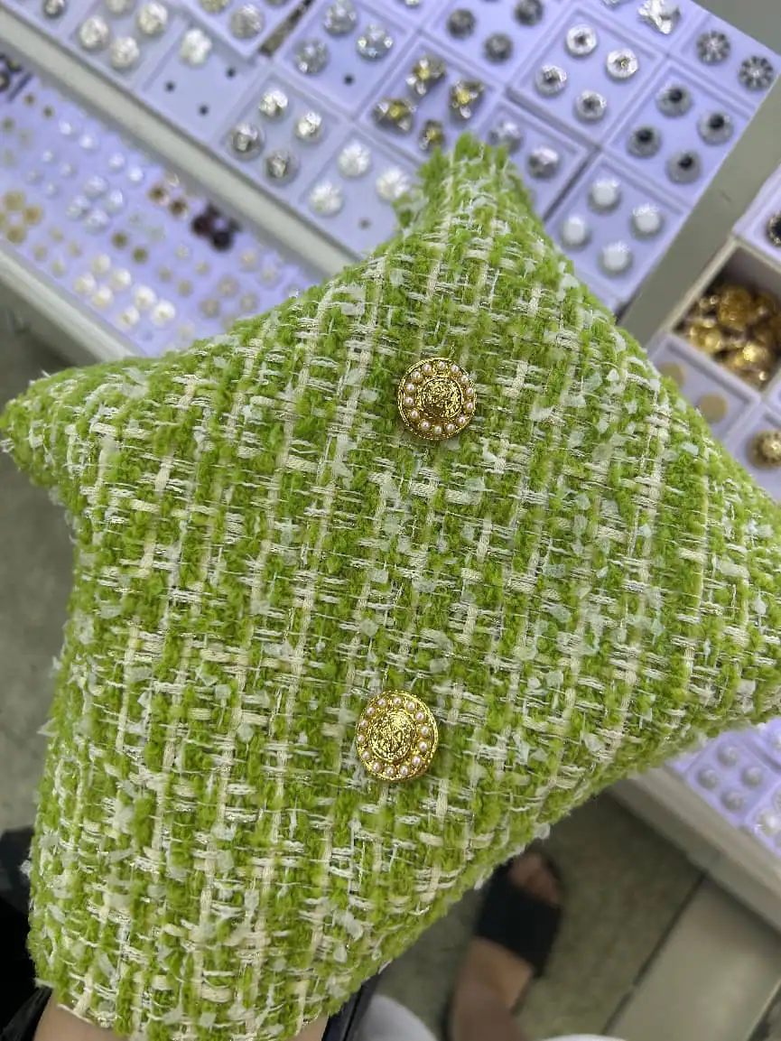 Green tweed with jewel button — fabric developed by Belleza