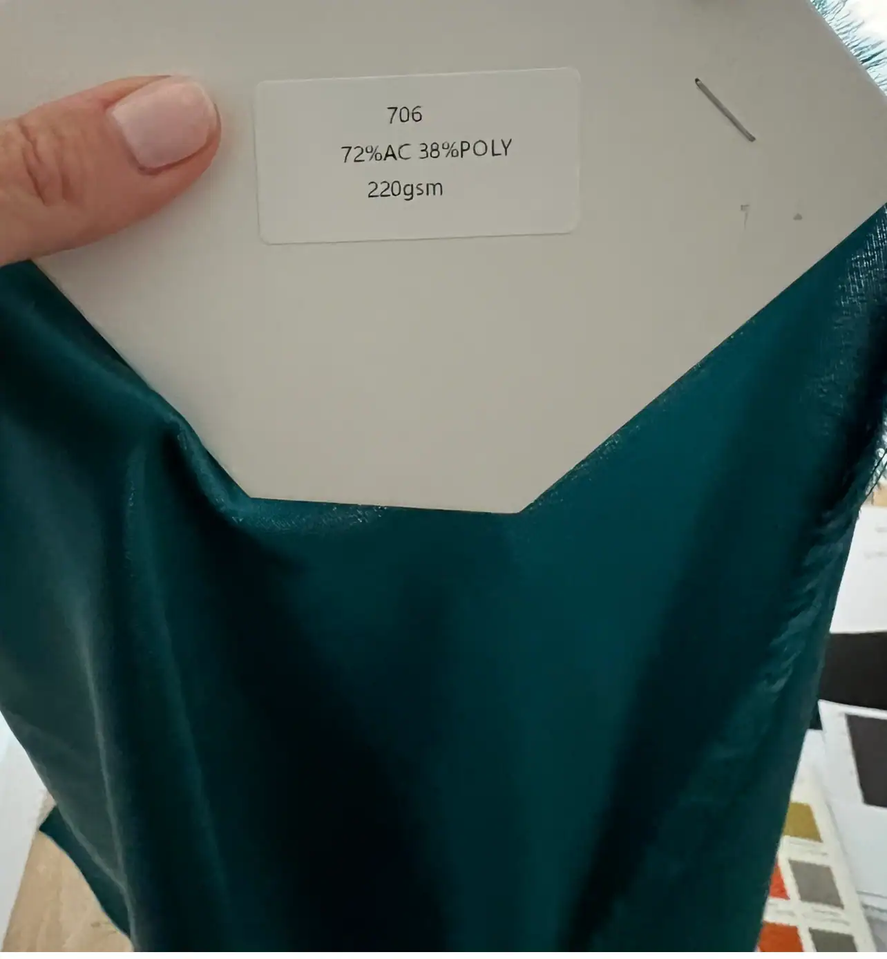 Satin with its quality card — made in the Belleza workshop
