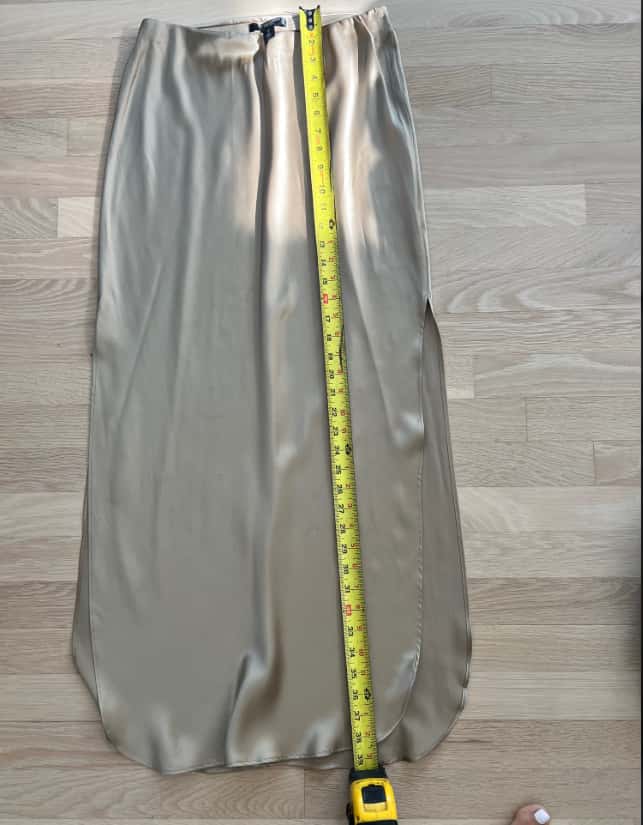 A finished skirt, measured against the spec — made in the Belleza workshop