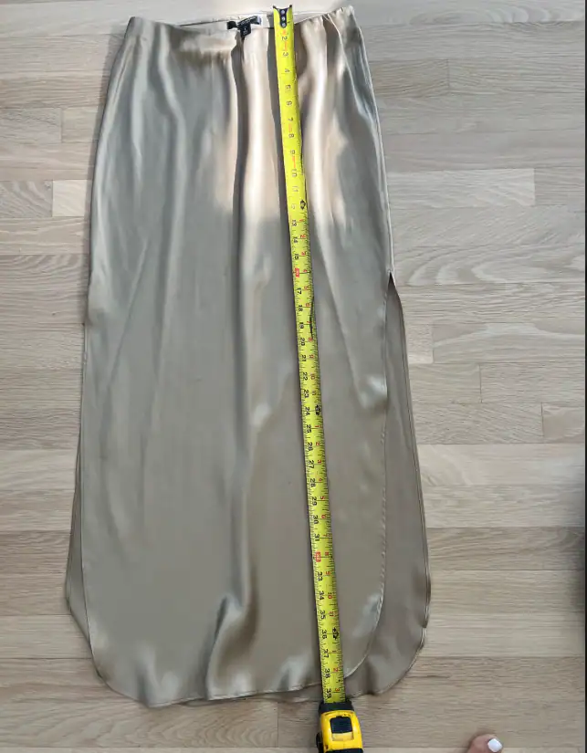 A finished skirt, measured against the spec — made in the Belleza workshop