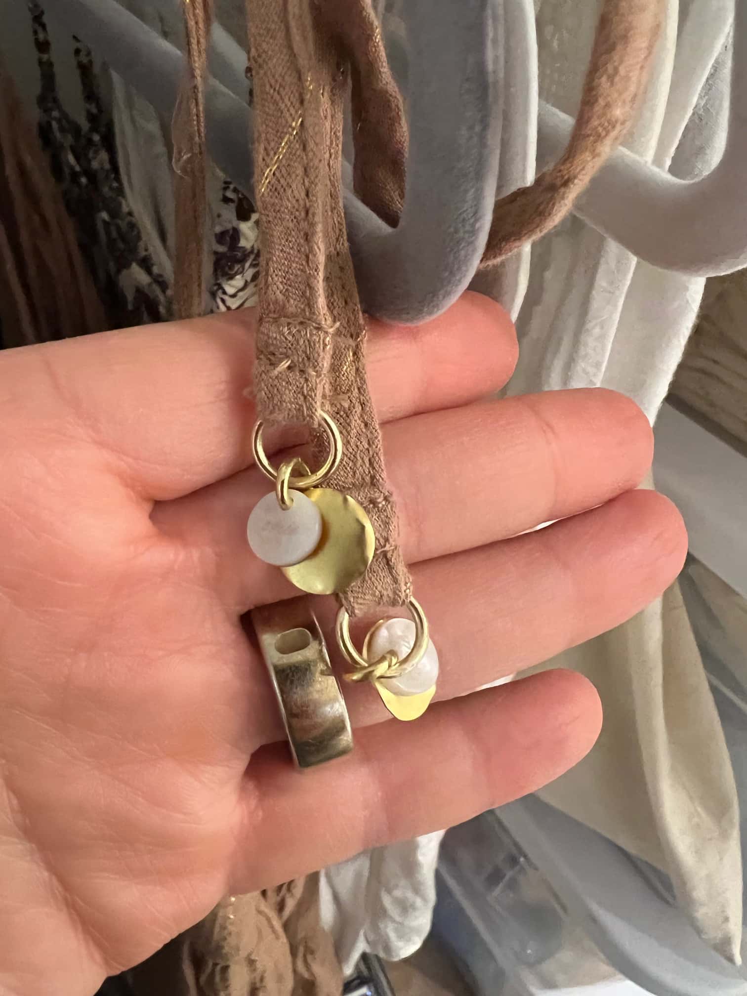 Metal trims and toggles under selection — made in the Belleza workshop